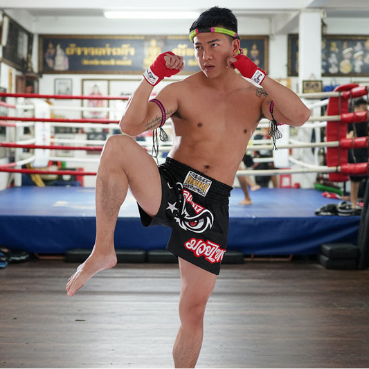 Man in athletic wear with visible branding on a white background
