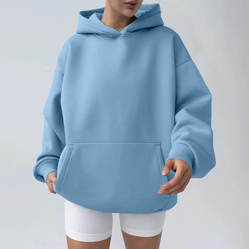 Unisex solid color sports hoodie in fleece material, worn by couple