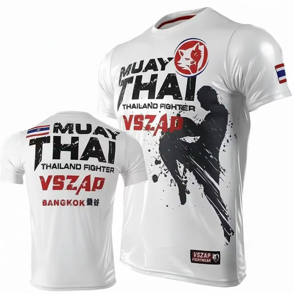 White short-sleeve athletic t-shirt shown from front and back, featuring 'MUAY THAI THAILAND FIGHTER' text, a red circular cat logo, a black fighter silhouette graphic, and 'VSZAP' branding. A small Thai flag appears on the sleeve, and 'VSZAP WARRIOR' is printed near the lower hem.