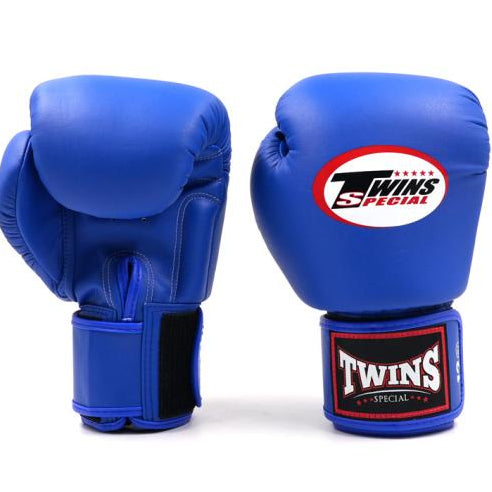 Blue boxing gloves with Twins Special logo on a white background