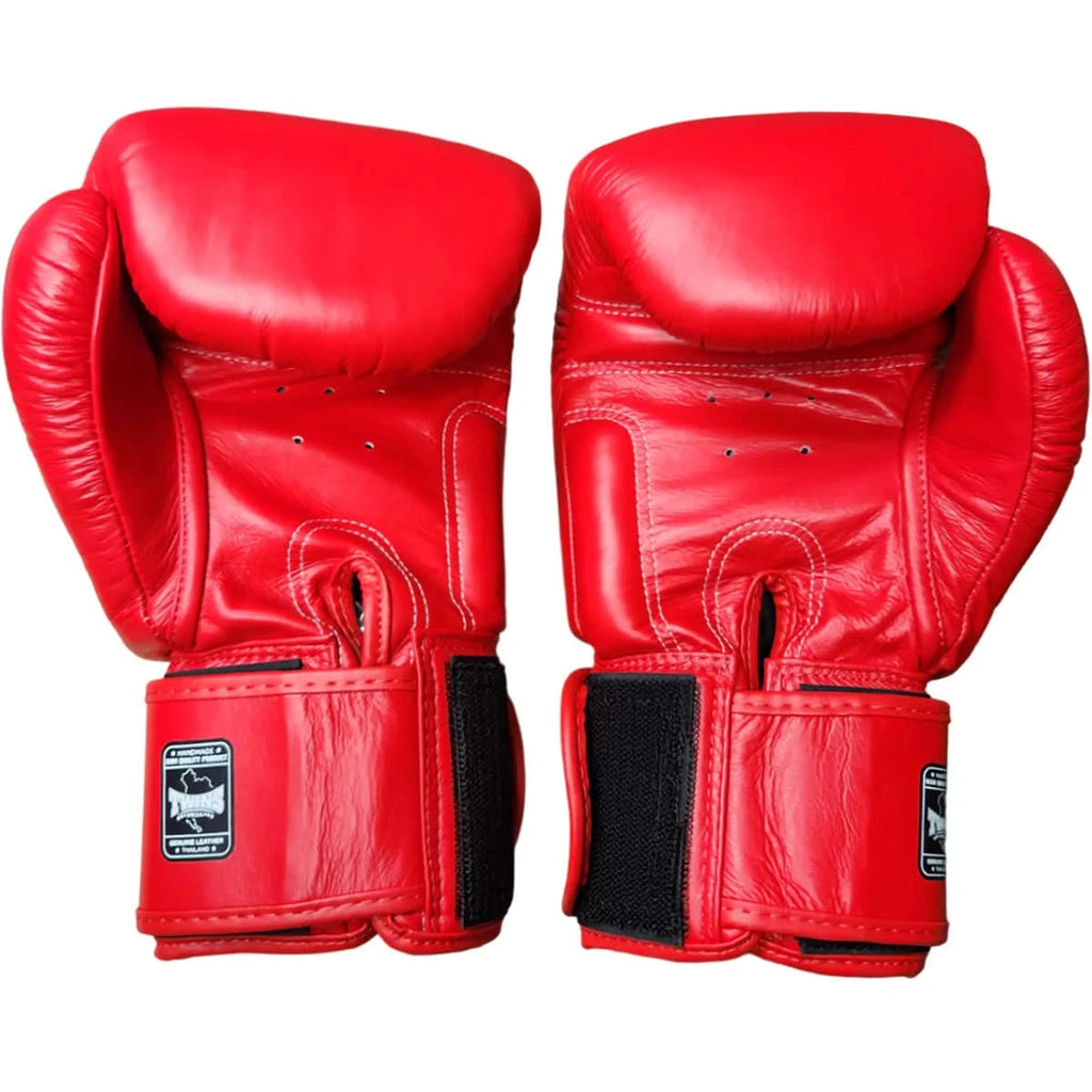 Pair of red boxing gloves on a white background