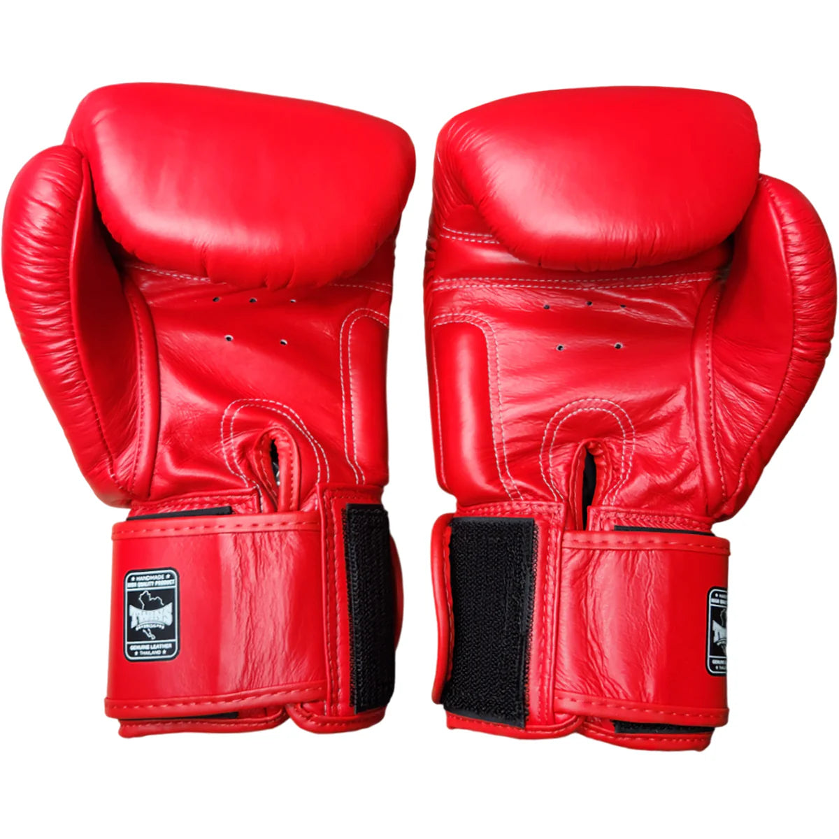 Pair of red boxing gloves on a white background