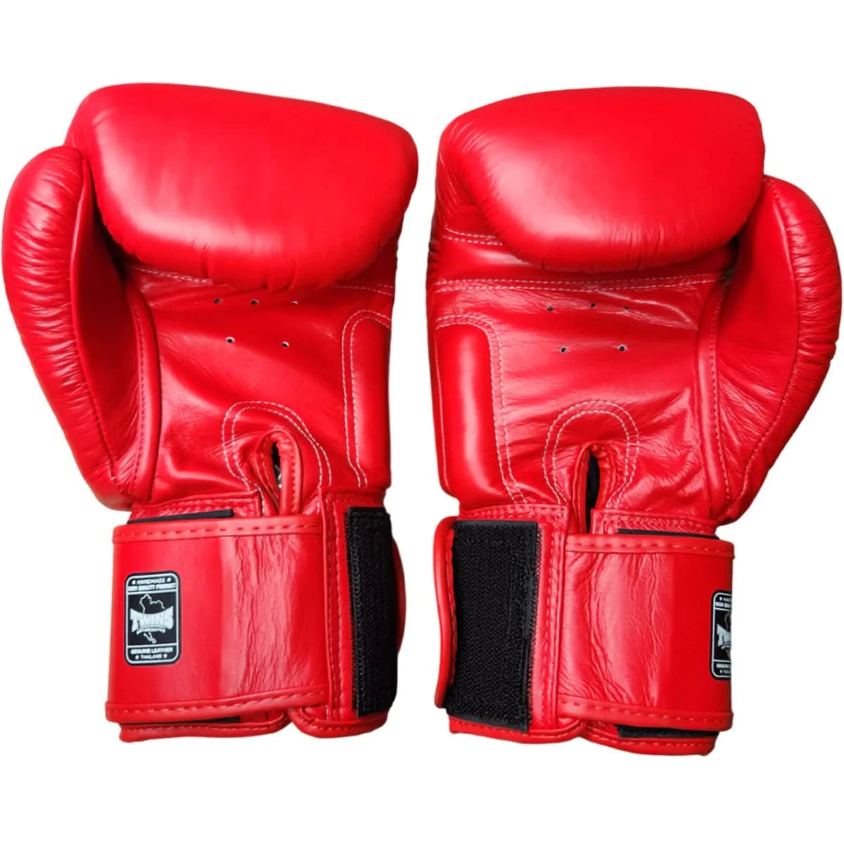 Pair of red boxing gloves on a white background