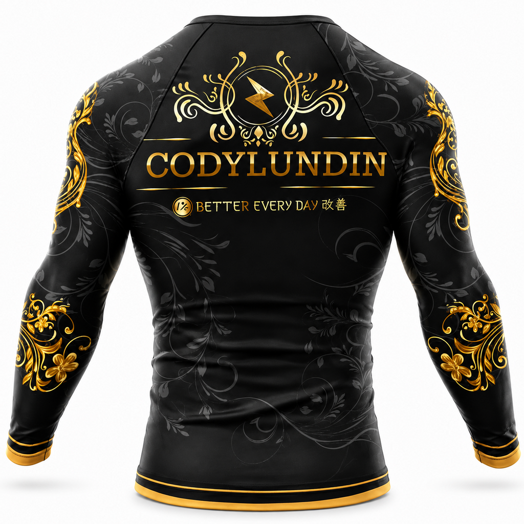 Black long-sleeve athletic rash guard with gold and gray decorative graphics, featuring the name 'CODYLUNDIN' and the phrase 'BETTER EVERY DAY' on the back, shown on a white background.
