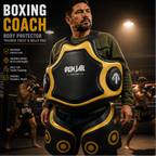 Person wearing a boxing coach body protector with Iron Lab branding in a boxing ring setting.