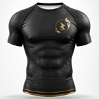 A black short-sleeve athletic rash guard with a subtle tonal floral pattern, featuring a gold circular logo on the left chest with a lightning bolt and the word 'crash'.