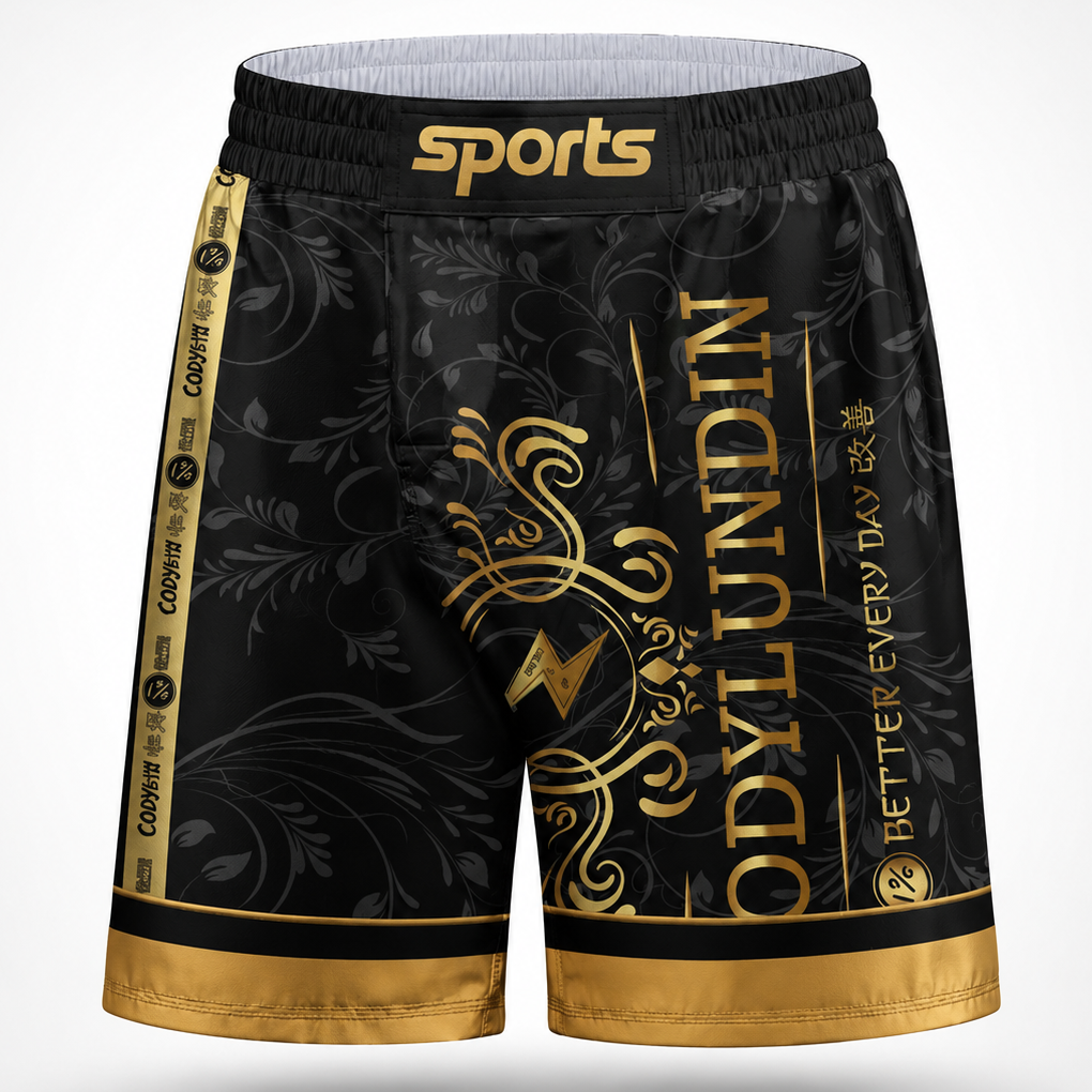 Black athletic shorts with gold ornamental graphics, gold trim, and a gold waistband logo reading 'sports'.