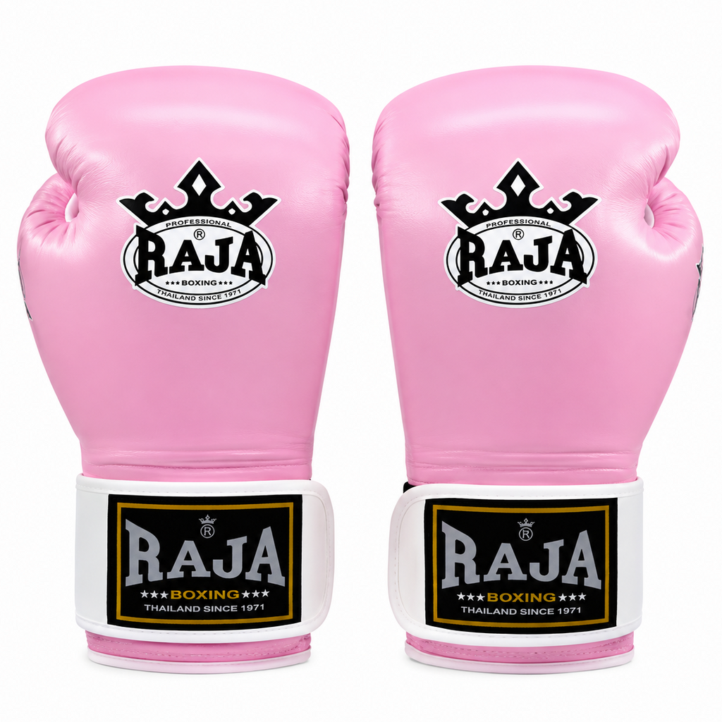 A pair of pink boxing gloves with white and black wrist straps and a black crown logo featuring the brand name 'RAJA'.