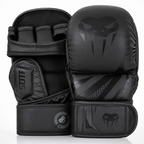 A pair of black MMA and Muay Thai sparring gloves with a dark gray Venum snake head logo, shown on a clean white background.