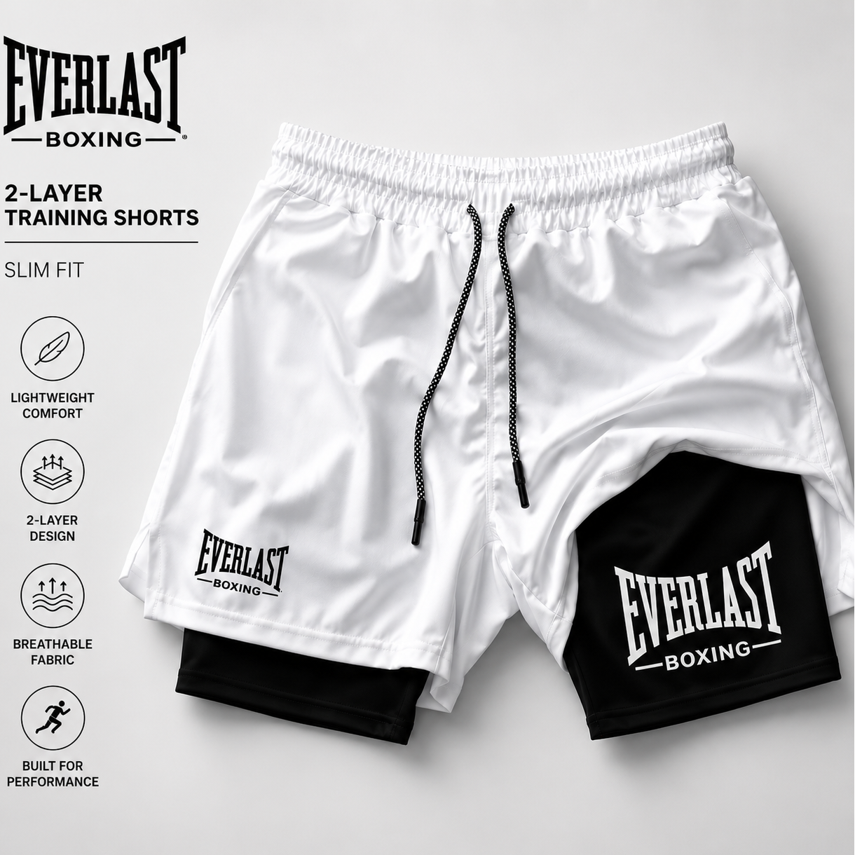 White and black Everlast boxing training shorts on a light gray background