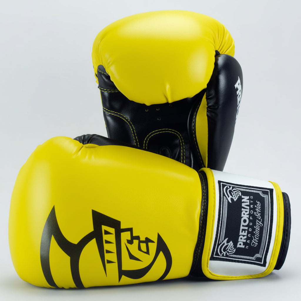 Yellow and black boxing gloves with a brand logo on a gray background