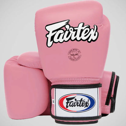 Pink boxing gloves with Fairtex logo on a light gray background