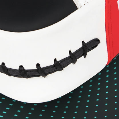 Close-up of a black visor with a white and red background