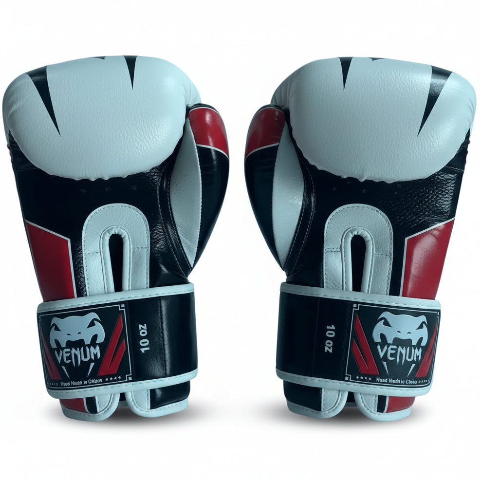 Pair of white boxing gloves with Venum branding on a light gray background