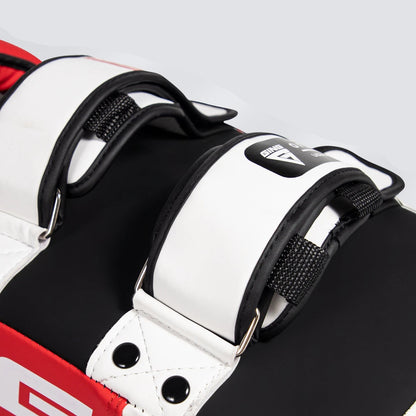 Close-up of a white and black sports equipment with red accents on a gray background