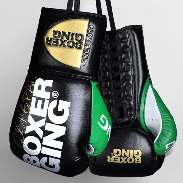 Pair of black and green boxing gloves with 'Boxer Gingo' branding on a light gray background