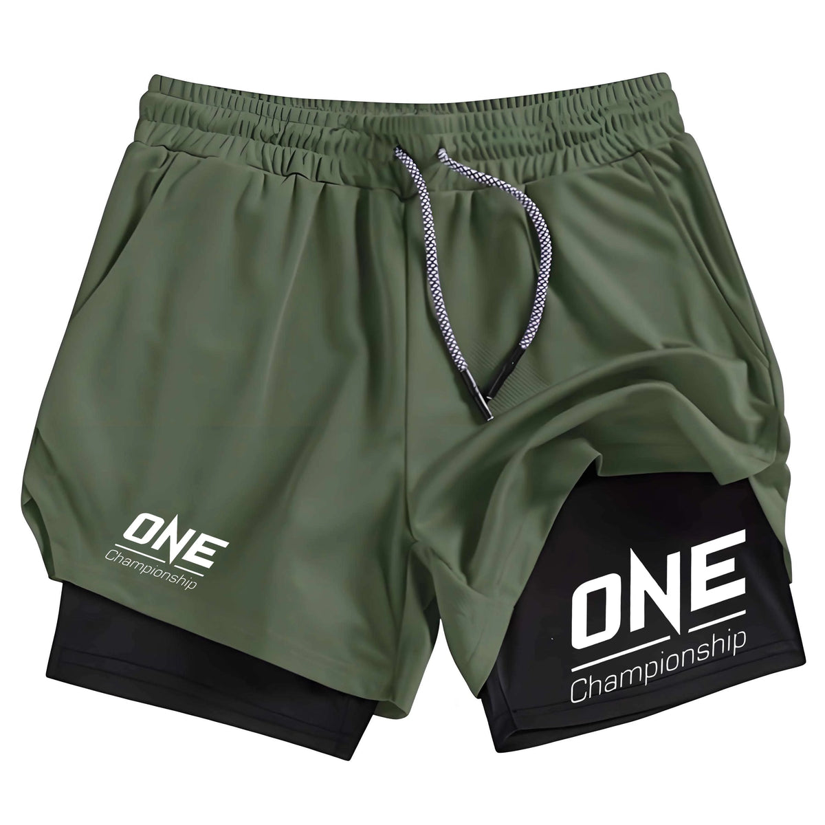 Olive green athletic shorts with a black inner layer, featuring a white 'ONE Championship' logo on the left leg and a larger black-and-white logo patch on the right leg, shown against a plain white background.