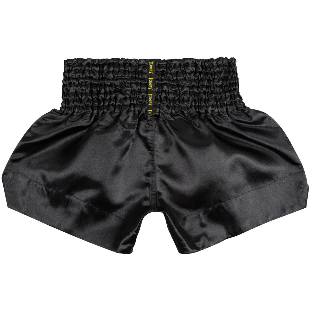 Black athletic shorts with a branded logo on a white background