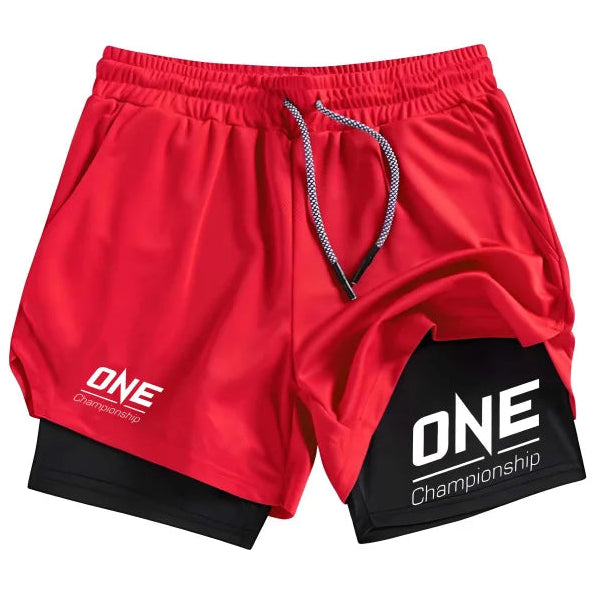 Red athletic shorts with a black inner layer, featuring white 'ONE Championship' logos on the left leg and right knee, with a gray and white drawstring.