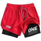 Red athletic shorts with a black inner layer, featuring white 'ONE Championship' logos on the left leg and right knee, with a gray and white drawstring.