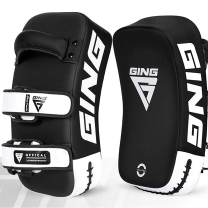 Black and white martial arts knee pads with 'GING' branding on a white background