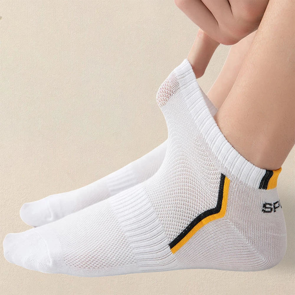 White socks with black and yellow accents on a beige background