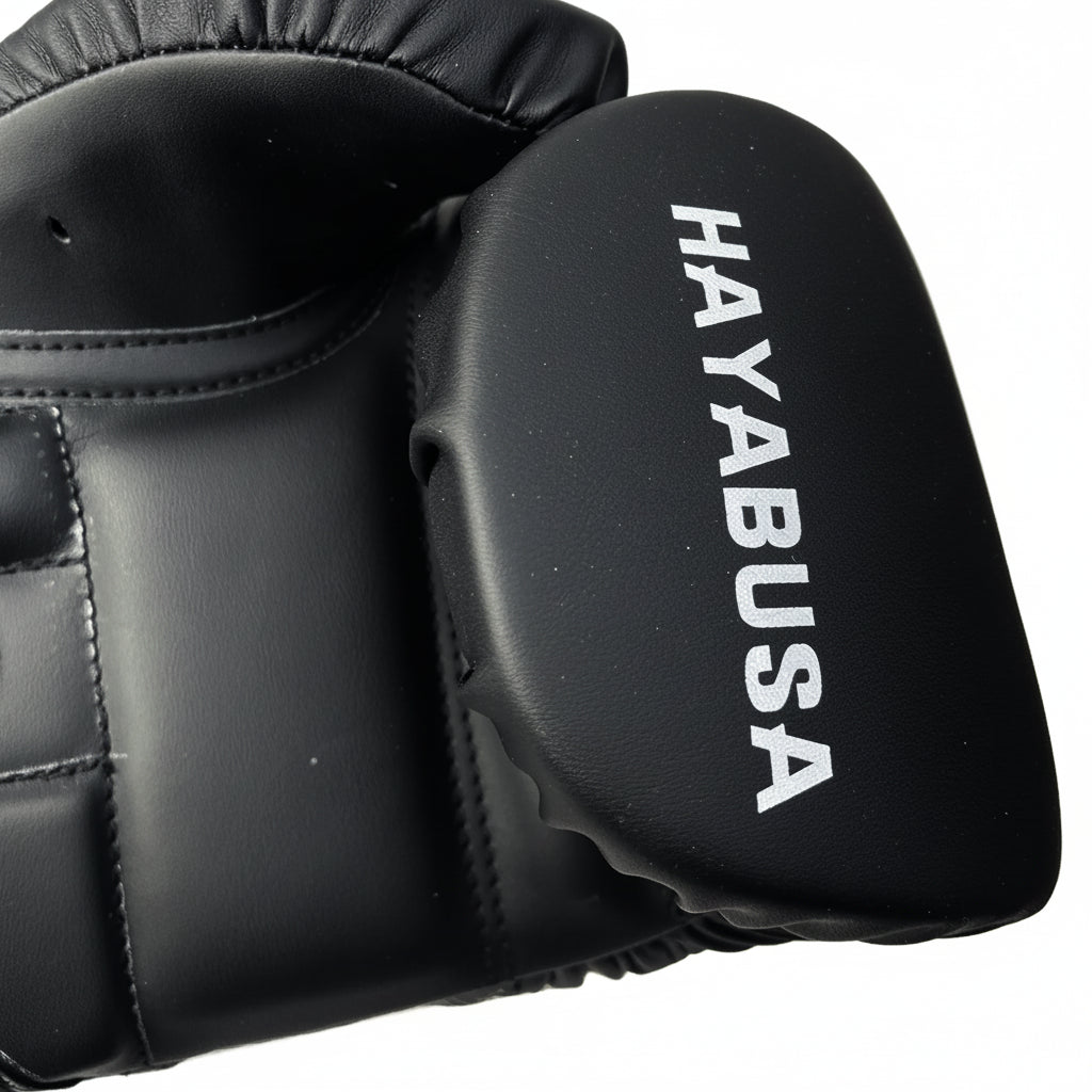 Black boxing glove with 'Hayabusa' branding on a white background
