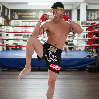 Man in athletic wear with visible branding on a white background