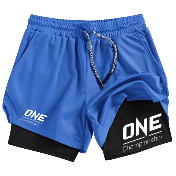 Blue athletic shorts with a black inner layer visible at the hem, featuring white 'ONE Championship' logos on the left leg and right leg, with a gray and white drawstring.