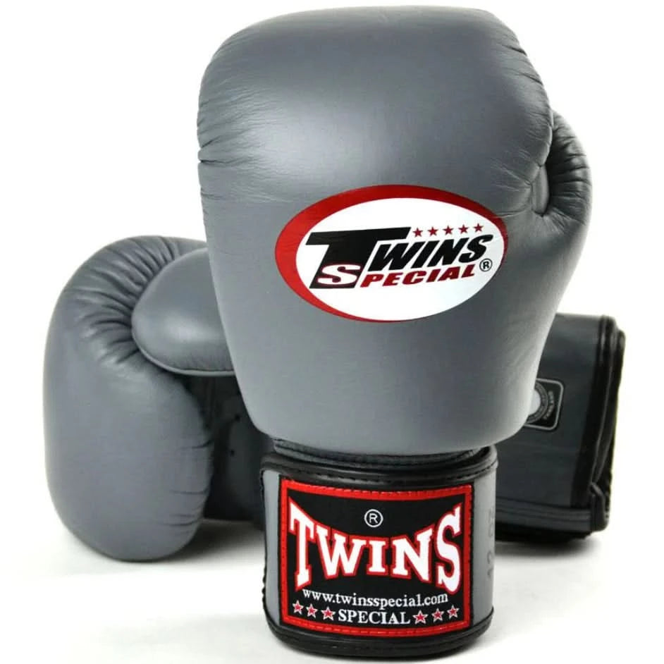 Gray boxing gloves with Twins Special logo on a white background