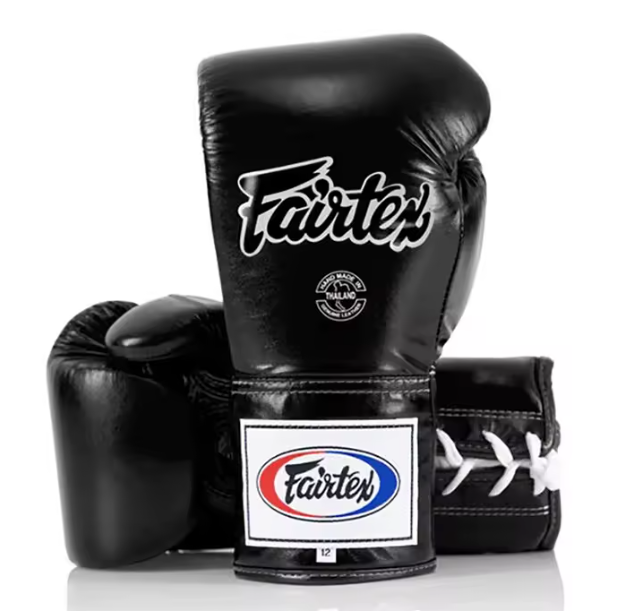 Black boxing gloves with Fairtex branding on a white background
