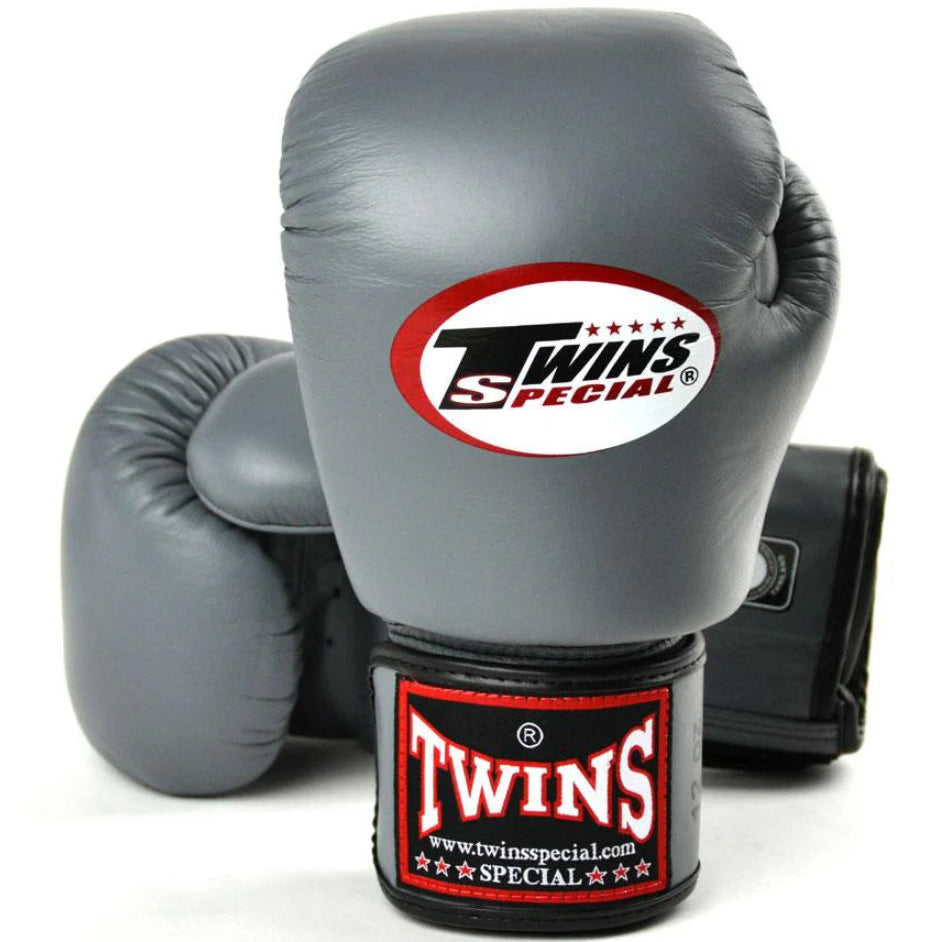 Gray boxing gloves with Twins Special logo on a white background