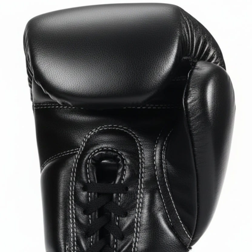 Black boxing gloves with Kuguan branding on a white background