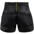 Black athletic shorts with a yellow logo on a white background, featuring the brand 'FLUORY'.