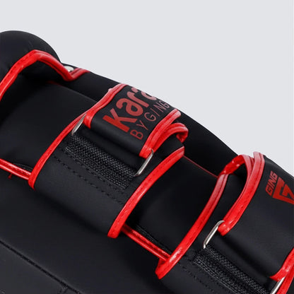 Black and red martial arts gear with a widened buckle design on a gray background