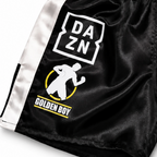 Black and white boxing shorts with multiple brand patches, including DAZN, WBC, Golden Boy, and Everlast, on a white background.