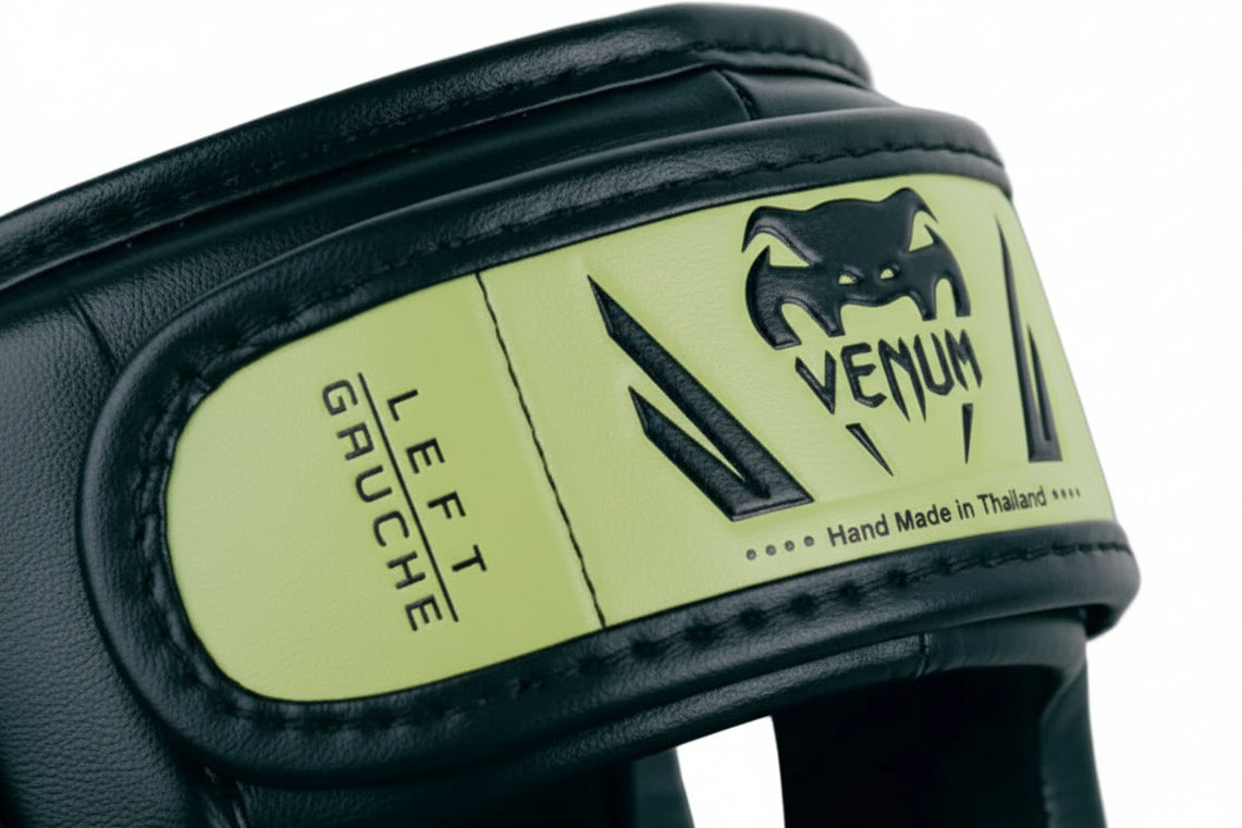 Venum Green Shin Guards featuring Venum logo on a gray background