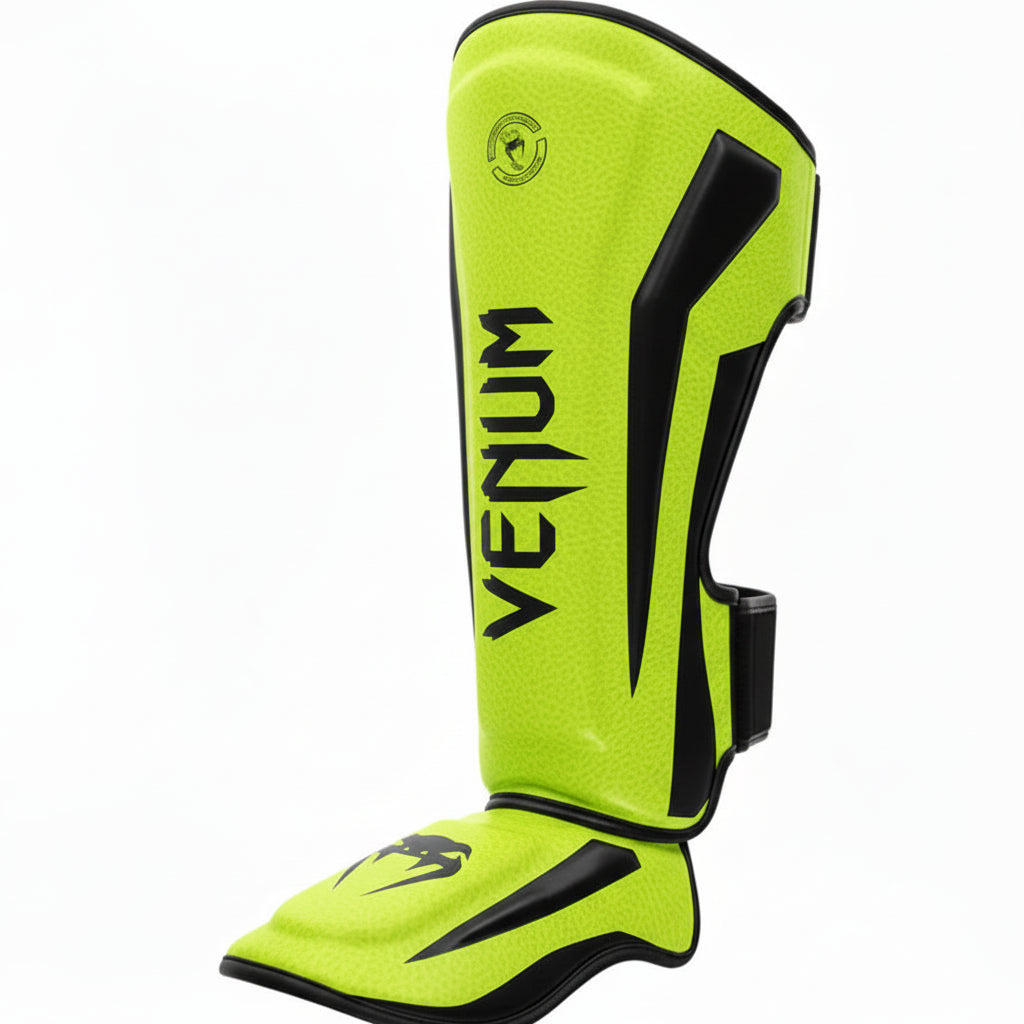 Green Venum shin guards on a white background