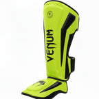 Green Venum shin guards on a white background