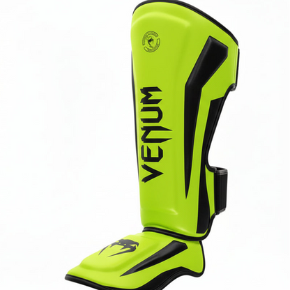 Green Venum shin guards on a white background