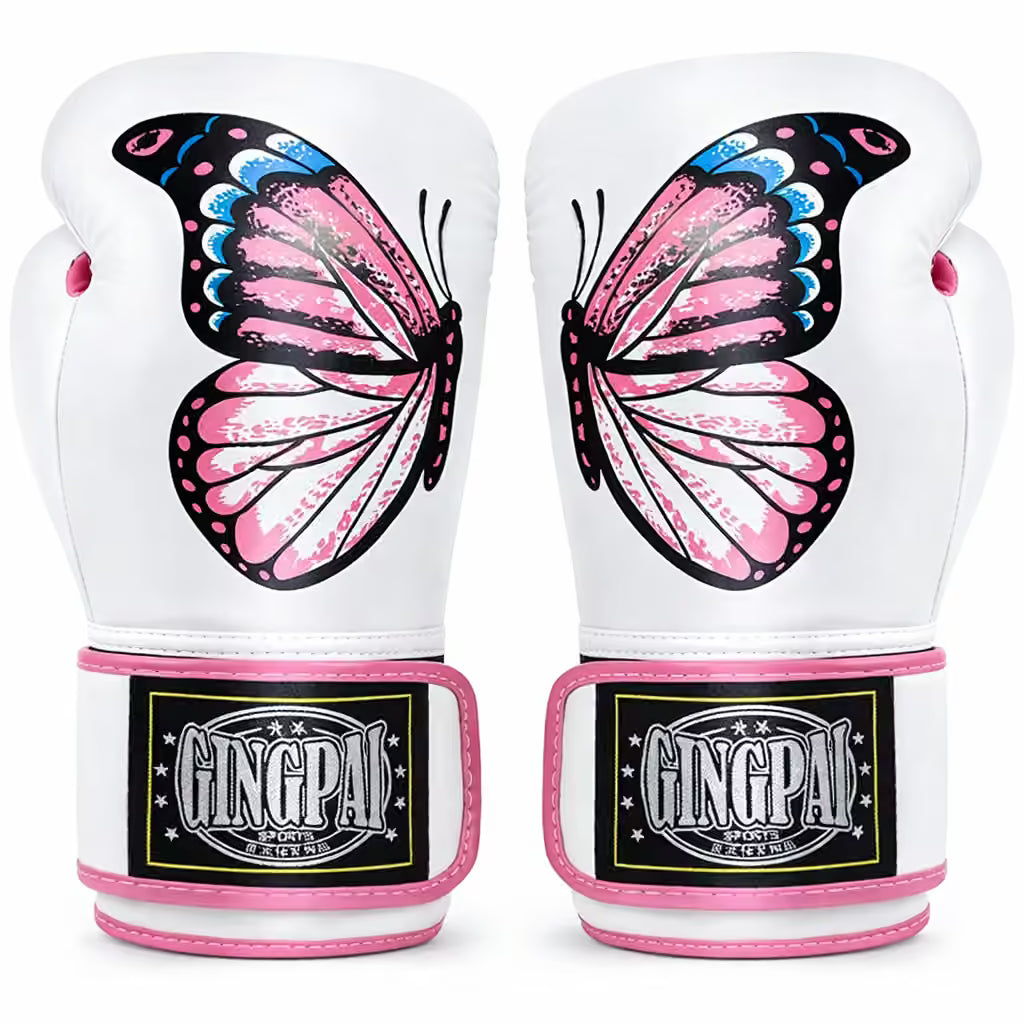 A pair of white boxing gloves featuring a large pink, black, and blue butterfly graphic on the back. The wrist area has pink trim and a black brand patch that reads GINGPAI SPORTS.