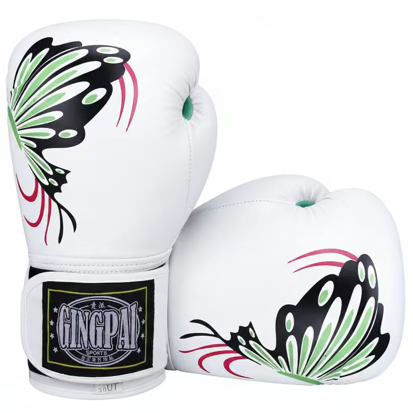 A pair of white boxing gloves featuring a stylized butterfly graphic in black, green, and pink, with a black and gold GINGPAI wrist strap on the front glove, set against a plain white background.