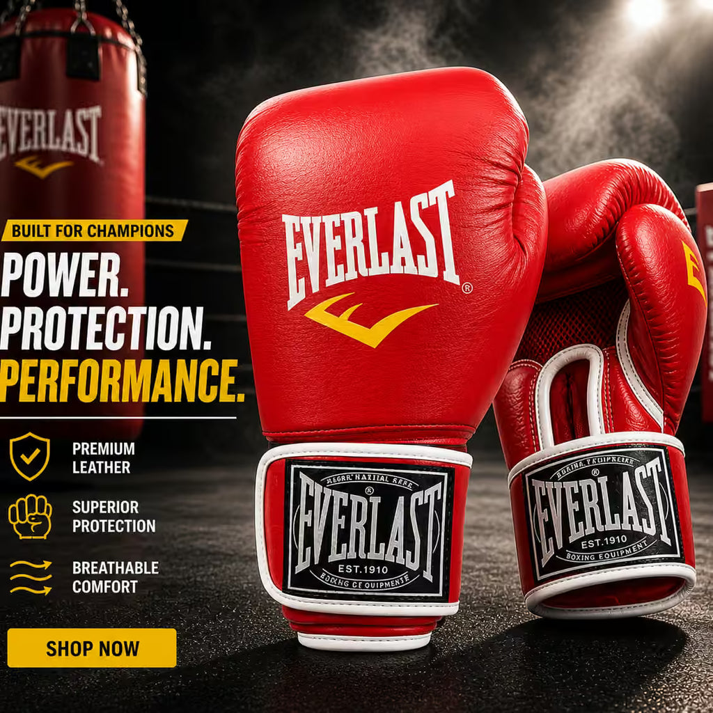 Two red Everlast boxing gloves with white and yellow branding, shown in a dramatic studio-style promotional scene with a hanging punching bag and marketing text on the left.
