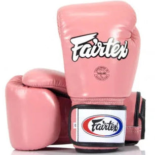 Pink boxing gloves with Fairtex logo on a white background