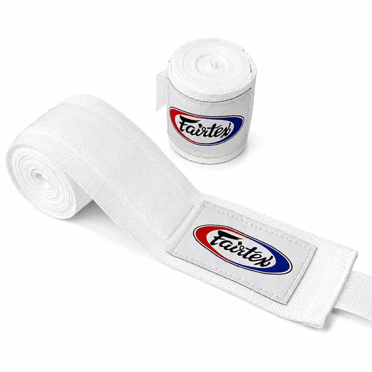 White Fairtex hand wraps, with one roll standing upright and another laid out diagonally to show the branded patch on a clean white background.