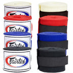 Eight rolls of Fairtex hand wraps arranged in two columns of four, showing the available color options: cream, red, blue, and black, with the Fairtex logo clearly visible on each roll.