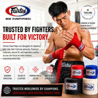 Promotional graphic for Fairtex hand wraps featuring a shirtless fighter wrapping his hands in red Fairtex wraps inside a boxing ring. Multiple color options (red, blue, black, white) are displayed at the bottom, with text highlighting features like 'Handmade in Thailand' and 'Trusted by Fighters.
