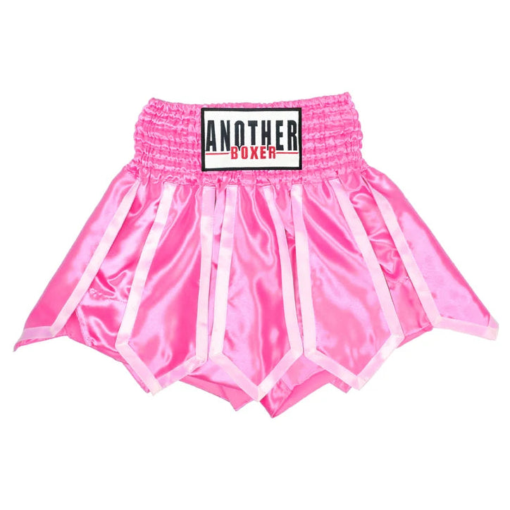 Pink satin boxing shorts with white trim and a black, white, and red 'ANOTHER BOXER' logo patch on the waistband, shown against a plain white background.