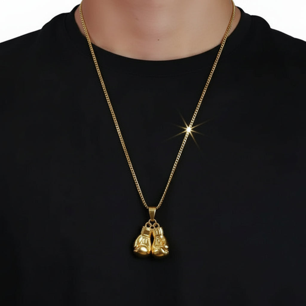 Person wearing a gold chain with boxing gloves hanging on chain