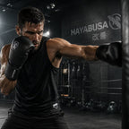 Boxer in a gym wearing Hayabusa gloves and shorts, with the brand name visible.